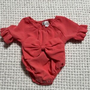 Charming Coral Baby Onesie with Ruffle Sleeves